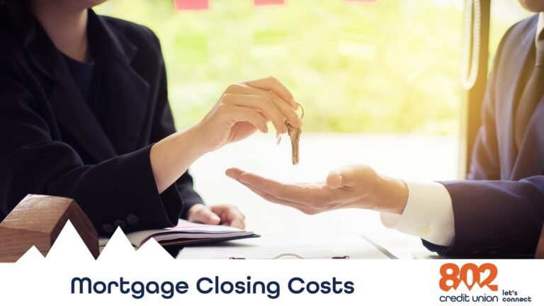 Image of hands over a table exchanging keys.