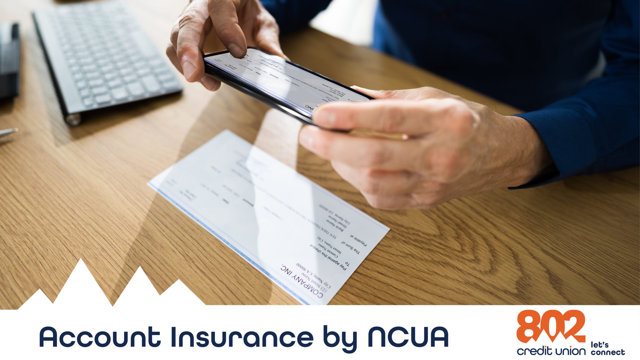 Image of hands mobile depositing a check