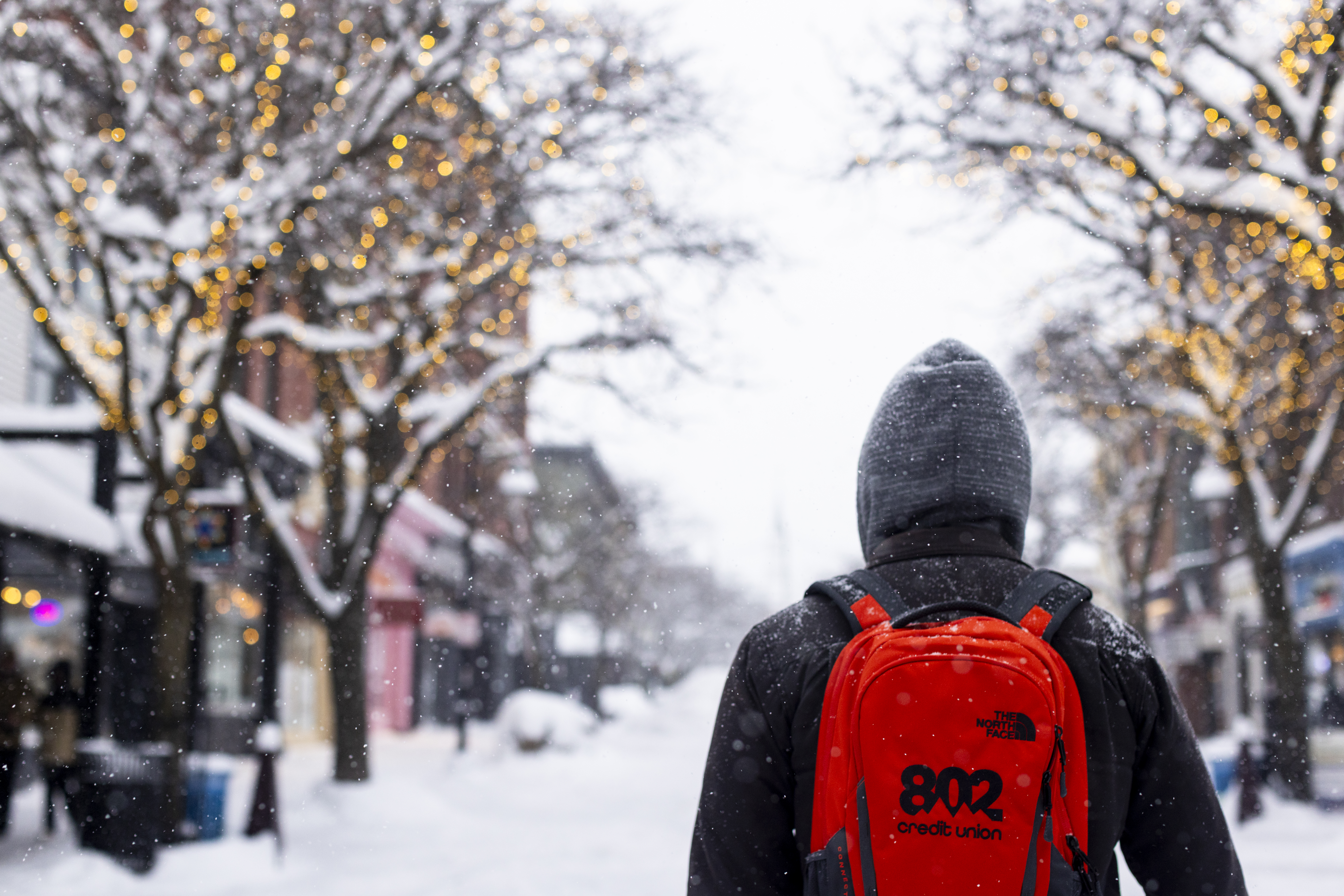 Homepage grapic, whales Tails Randolph man with 802CU backpack